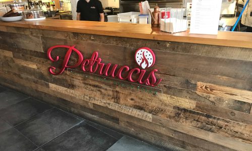 Pizza Restaurant Acrylic Sign used at reception desk.
